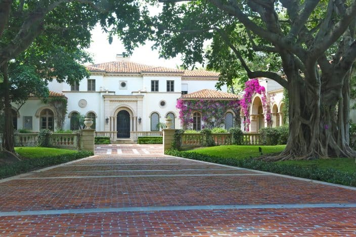 One of the mansions you can glimpse as you drive through Palm Beach during your romantic getaway