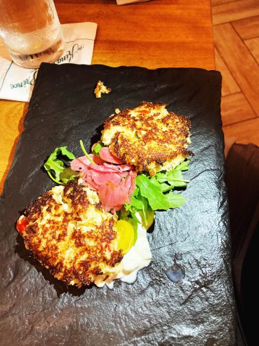 crab cakes on a slate platter