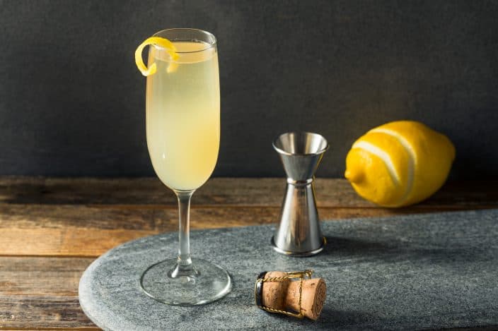 Boozy Refreshing French 75 Cocktail with Lemon and Champagne, is a great cocktail to celebrate New Year's Eve at home.