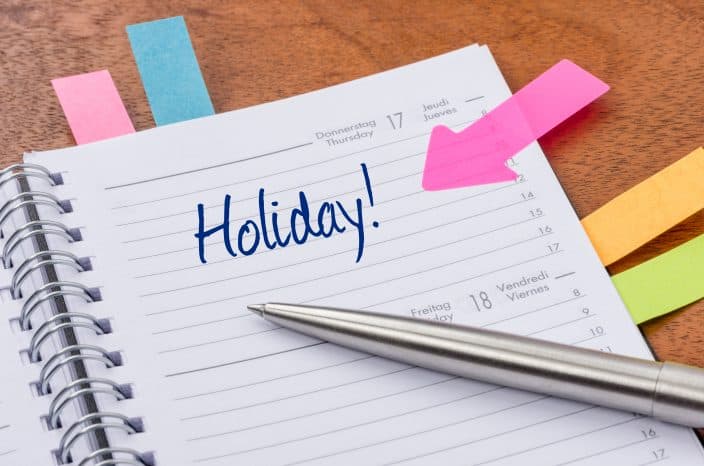 a daily planner with your holiday scheduled so you can pack in advance