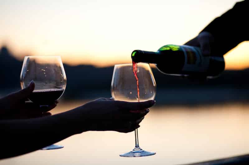 wine glasses with a sunset backdrop to represent a vineyard. A great idea for a romantic adventure getaway.