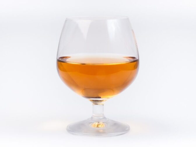 glass of mead on white background