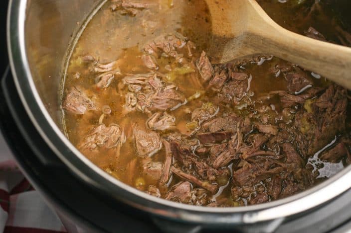 shredded roast beef in broth to make italian beef