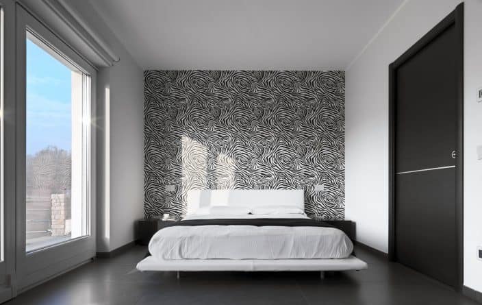 a bedroom with one wall of wallpaper that is black and white, great for home renovation