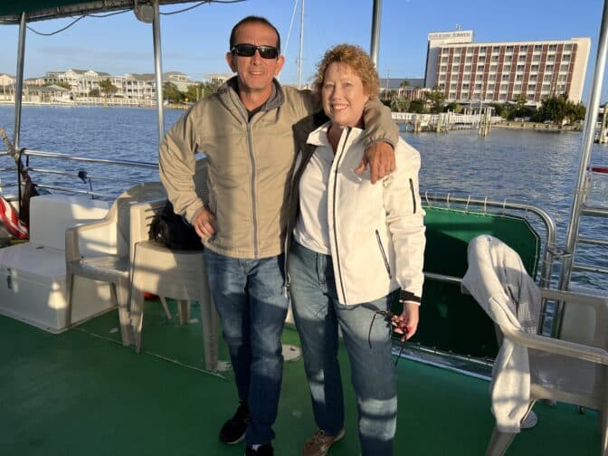 couple on boat on the river in Wilmington NC