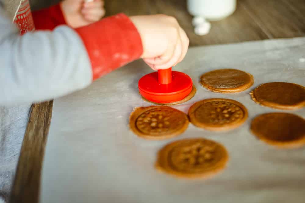 Little one using cookie stamps which make a great christmas baking gift! 