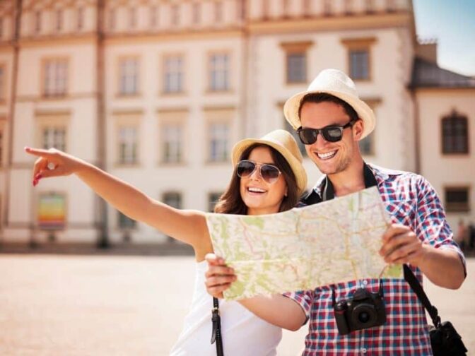 couple looking at map in city