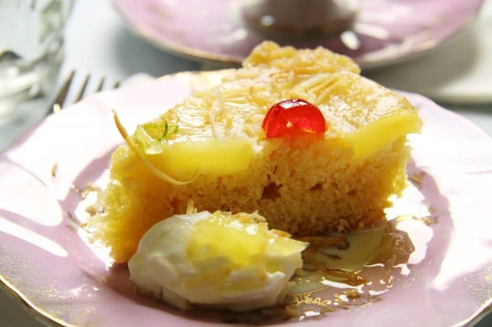 Fresh baked pineapple upside down cake with cherries.