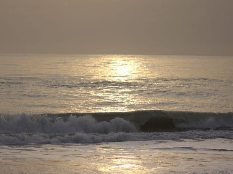 The beach at sunset with the sun dancing off the water. Melbourne Beach is one of the destinations that we love for the best romantic Florida getaways. Taking a sunset stroll along the beach is a perfect ending to your day.