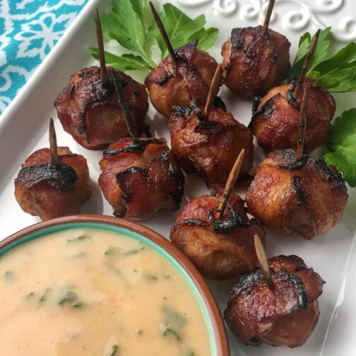 Water chestnuts wrapped in bacon with a spicy mustard dipping sauce