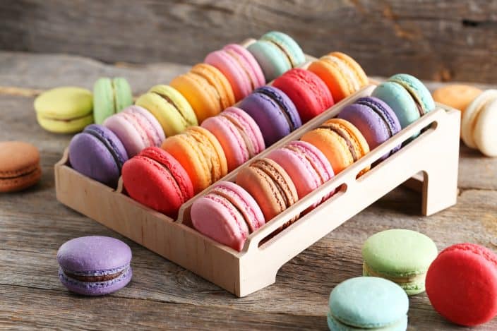 French colorful macarons on the wooden stand