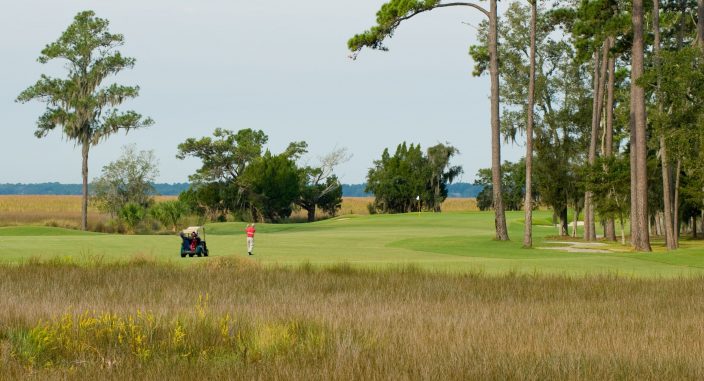 The King and Prince Golf course with marsh and golfer