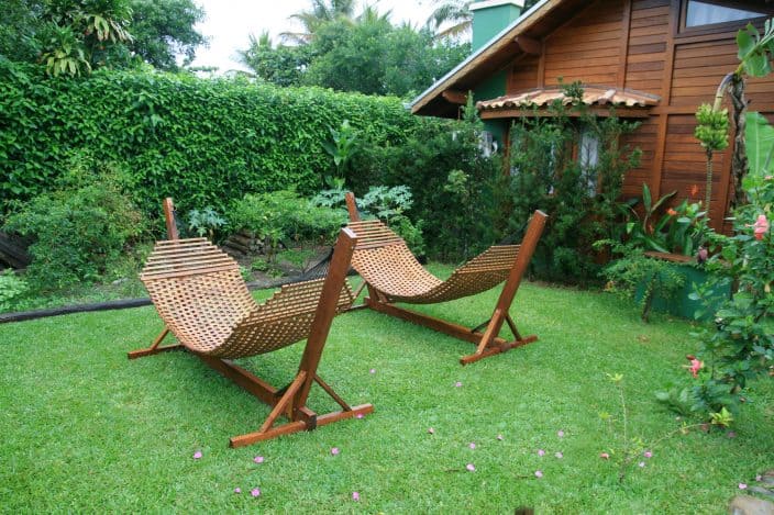 hammocks in a backyard as part of creating a backyard oasis