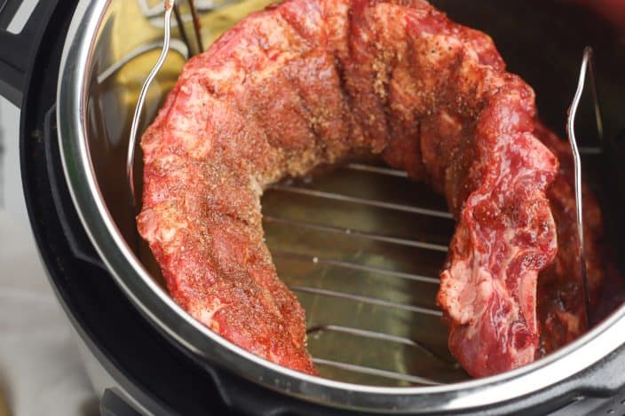 uncooked baby back ribs in an instant pot