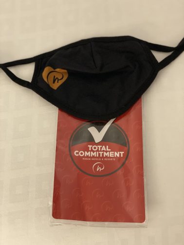 Black face mask with Rosen Plaza logo