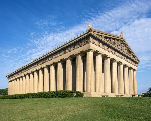 Parthenon Replica at Centennial Park in Nashville, Tennessee, USA with blue skies and green grass. 