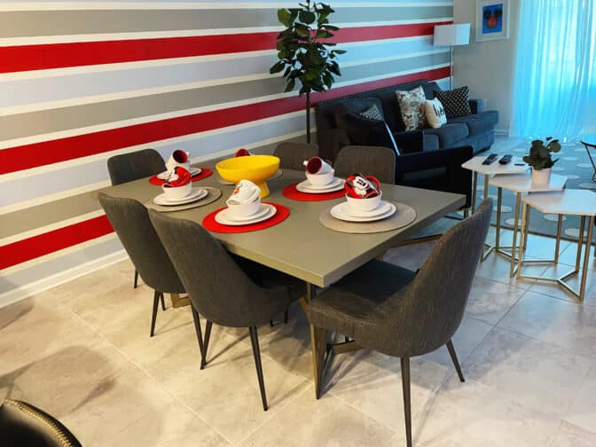 Disney themed dining room with red and black accents in a Kissimmee VHC rental home