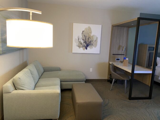 The inside of Springhill Suites in New Smyrna Beach with a coastal vibe, blue and beige accents