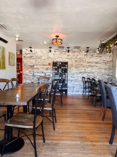 the interior at Riverpark Terrace restaurant with exposed brick and modern farmhouse accents