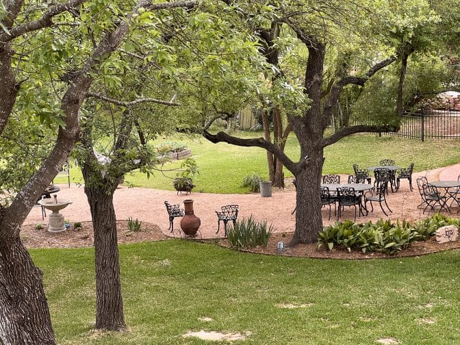 the outdoor dining and firepit area at the Milton parker home in Bryan, Texas