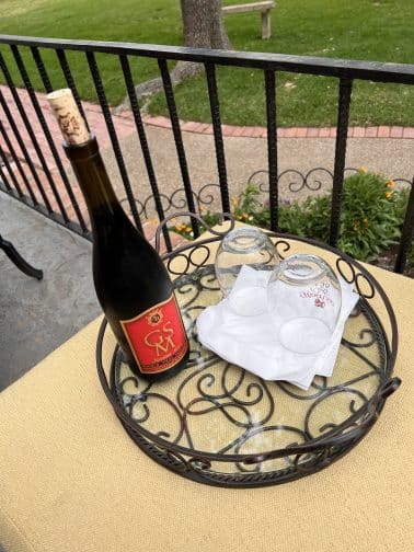 wine on a platter outside at the Milton Parker Home in Bryan Texas