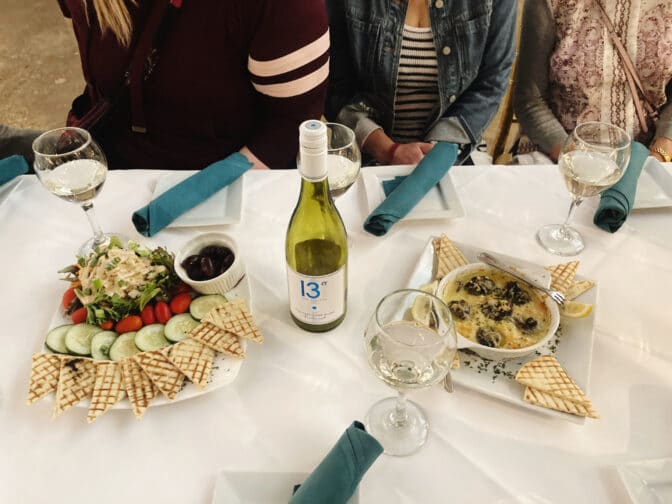 a table with food and wine pairings, an example of what you can experience during a food tour with the Tasting Tours