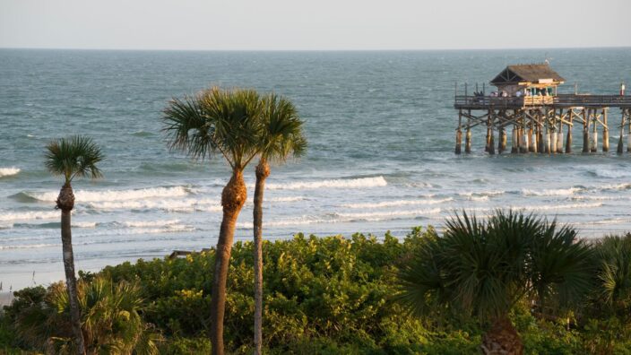 the view of Cocoa Beach and the pier in the background