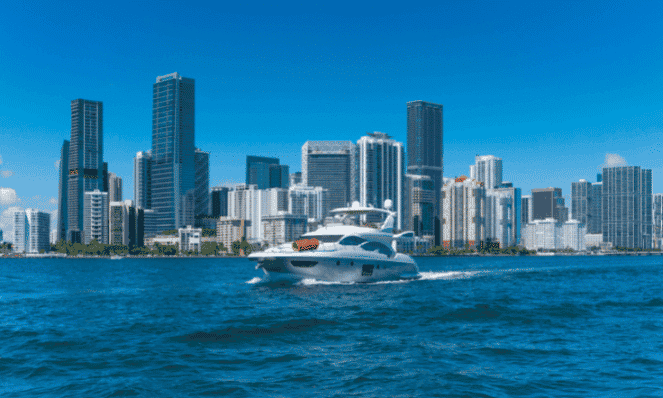 a boat in a Florida waterway with the city behind it, an example of what to do when visiting Florida for vacation
