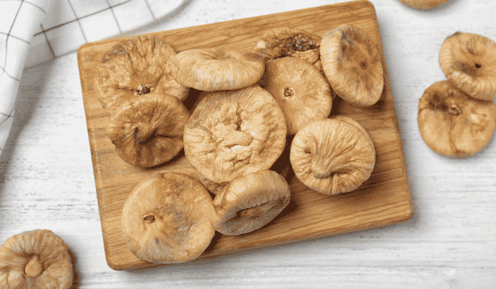 dried figs on a cutting board to use in the sweet version of the salad