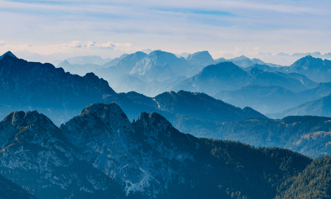 Aerial view of the blue ridge mountains with cloudy blue skies 