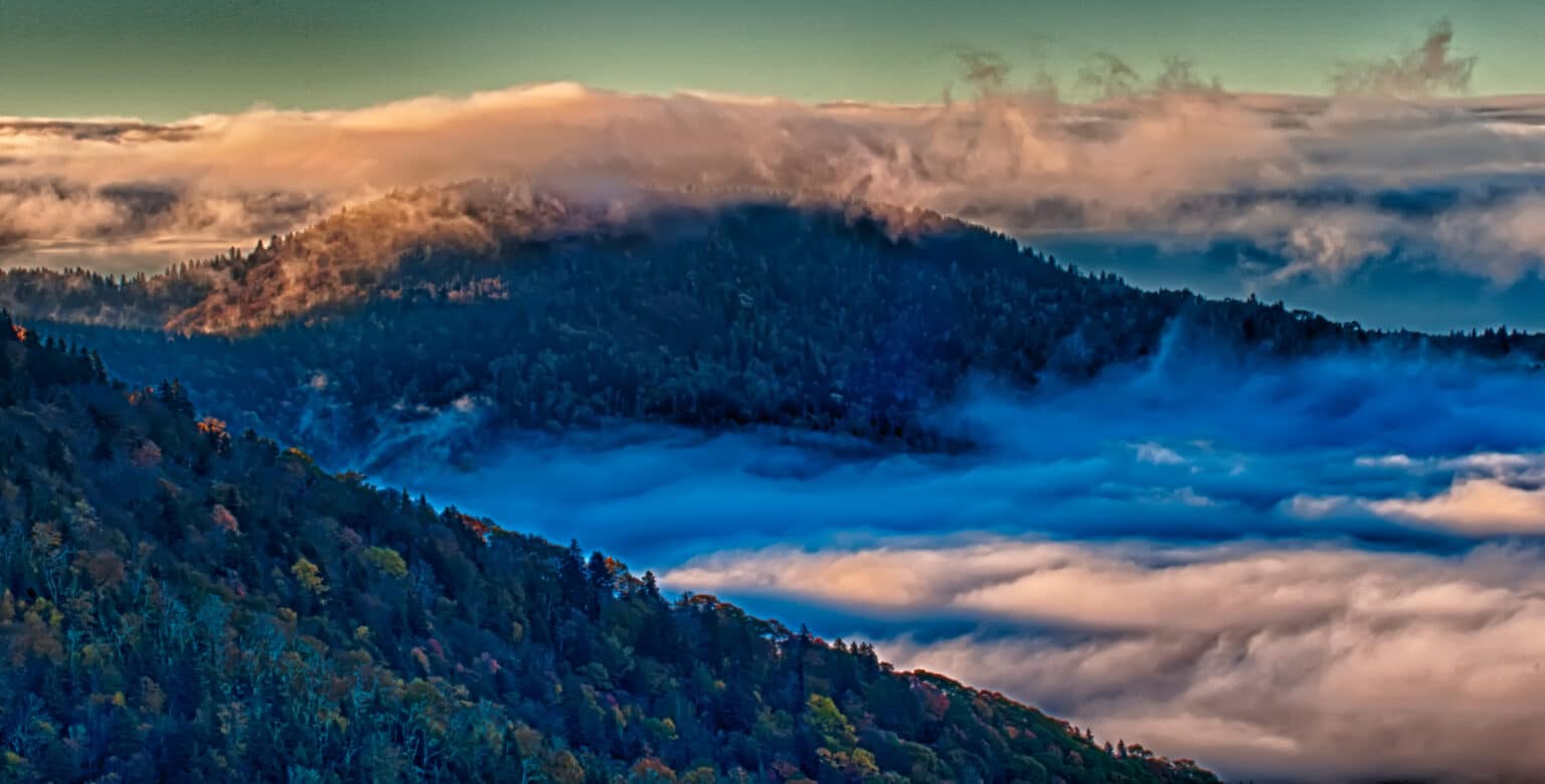 fog laying in the valleys with the mountains above