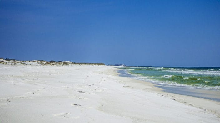 Gleaming white sand, bright blue sky and turquoise water 