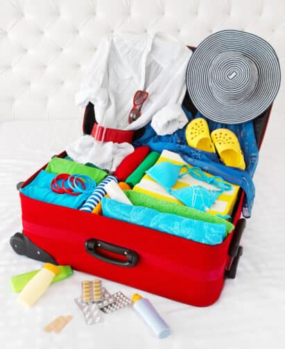 a suitcase with clothes and accessories
