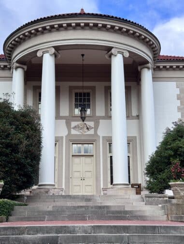 a building with columns and a staircase