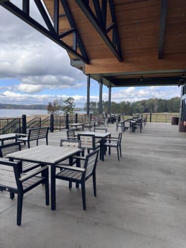 a patio with tables and chairs