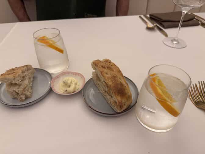 a plate of bread and a glass of water