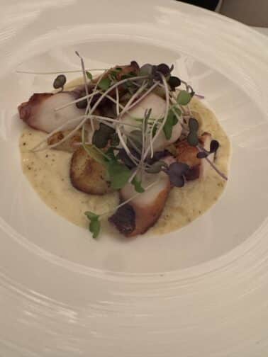 a plate of food with microgreens