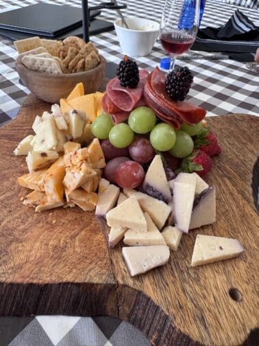 a plate of cheese and fruit