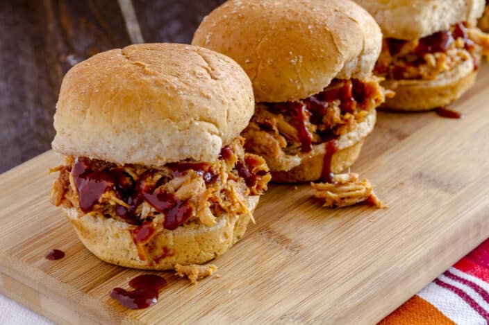 a group of sandwiches on a cutting board