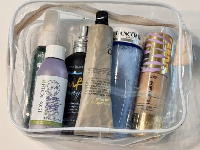 a clear plastic bag with different cosmetics in it